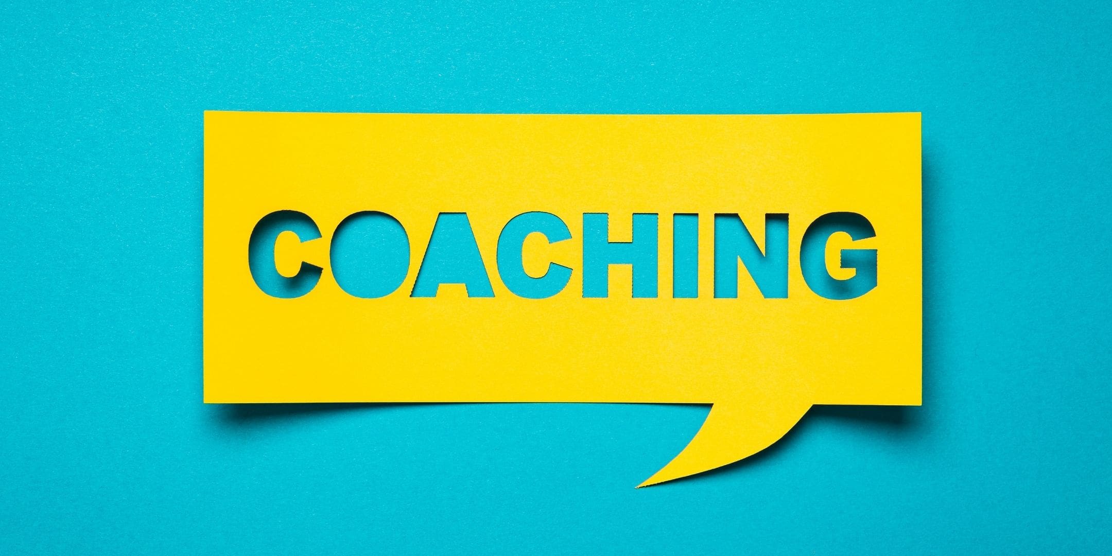 the word: coaching in a yellow dialogue box