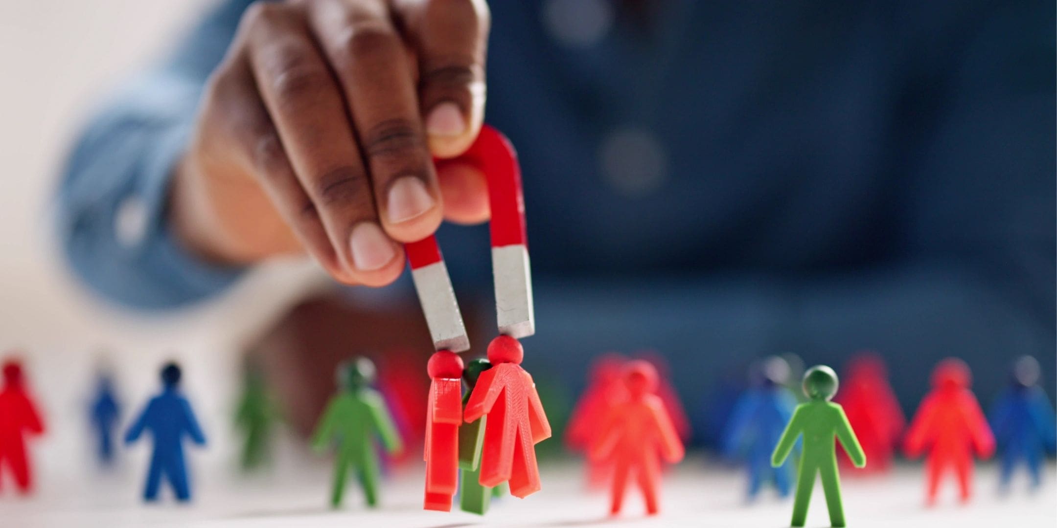 small magnetic figures being extracted by a magnet