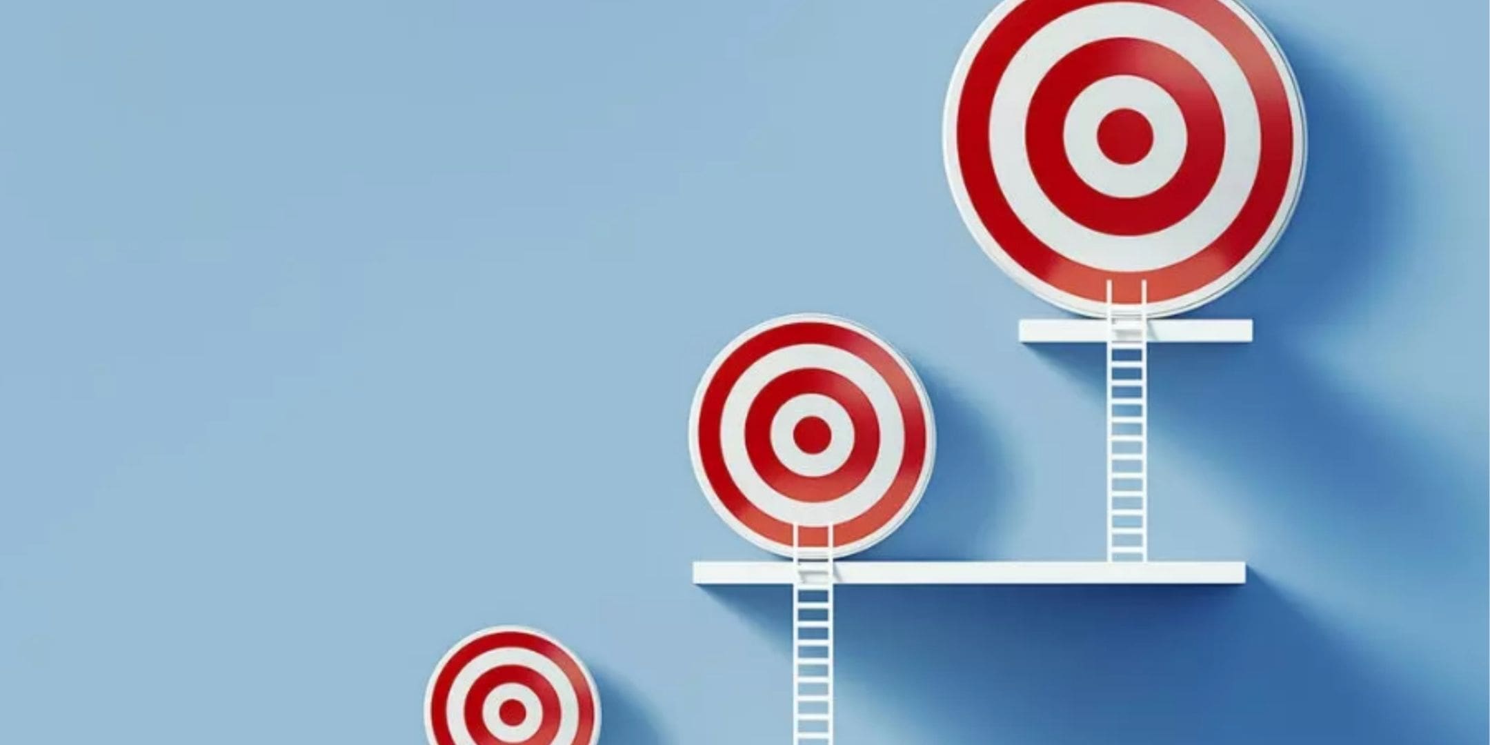 red and white targets growing progressively larger with white ladders leading up to each target