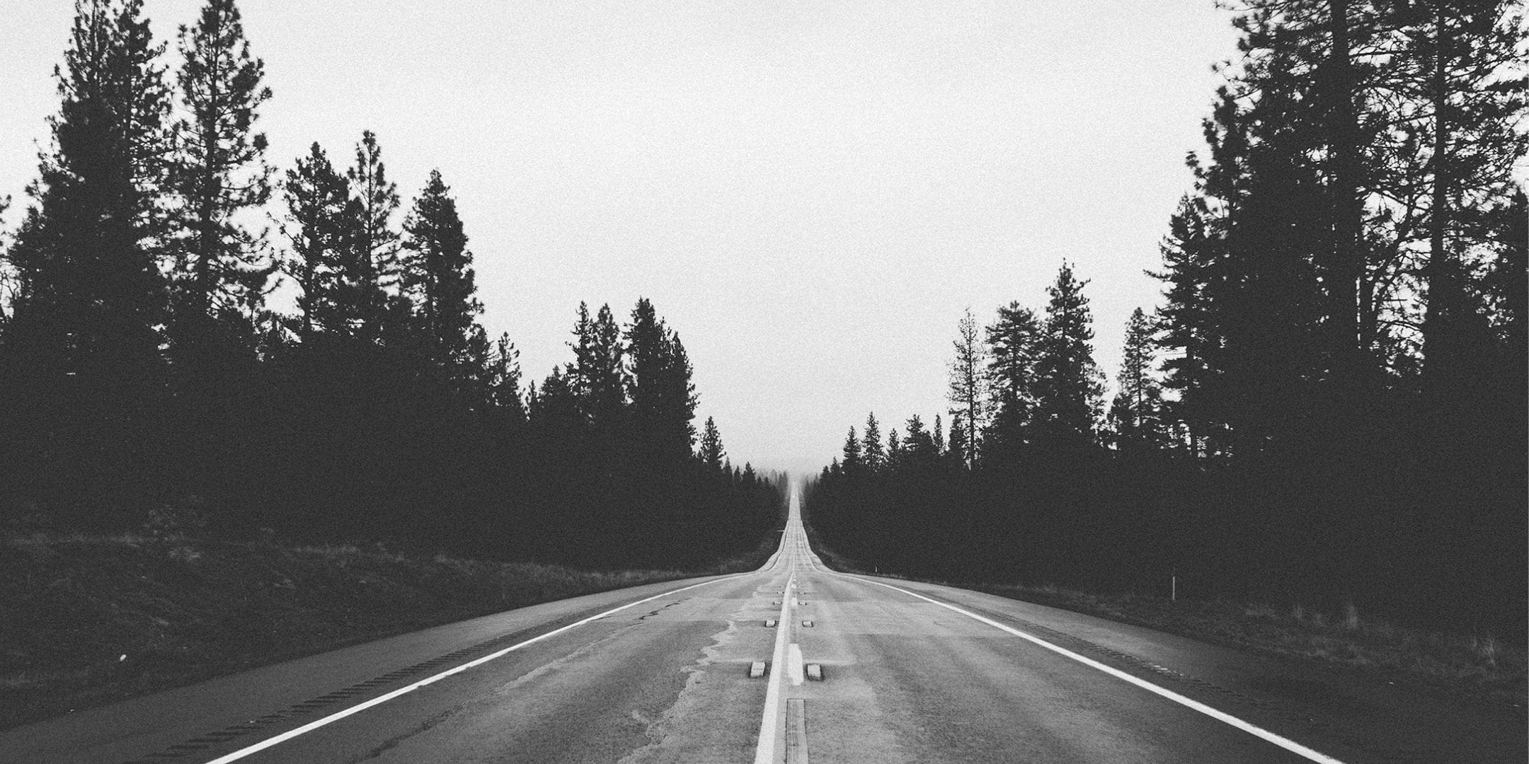 black and white photo of road